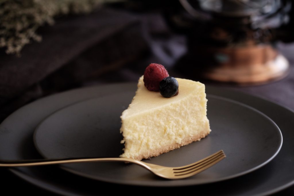 sliced of cake on black plate