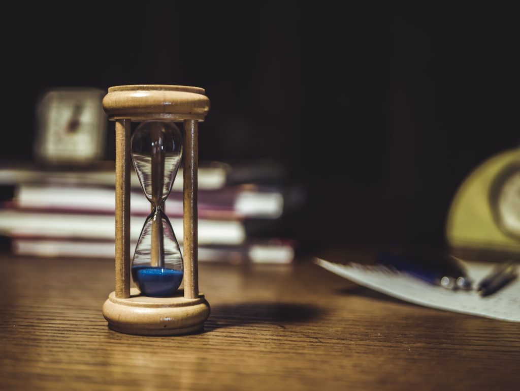 Hourglass on Brown Wooden Frame