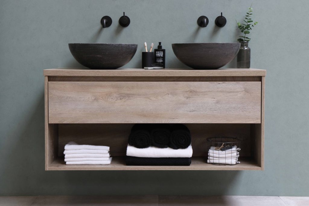 white and black ceramic bowl on brown wooden shelf