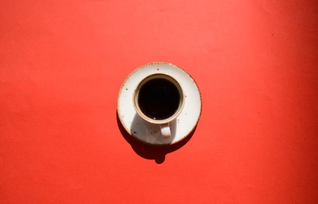 white ceramic mug on saucer