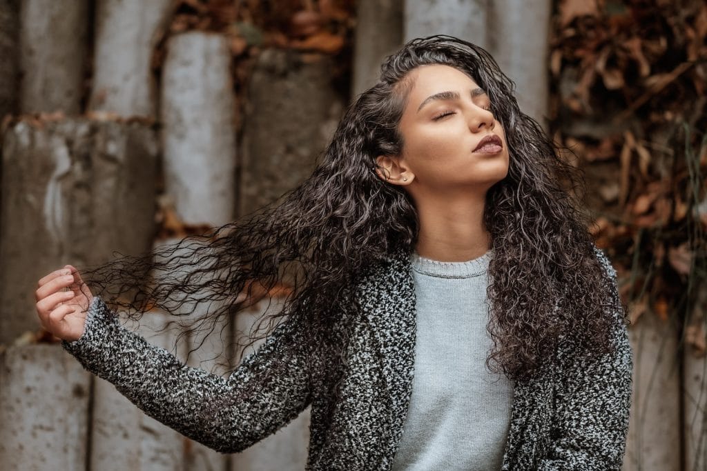 woman holding her hair