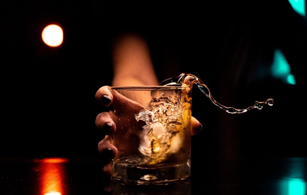 clear drinking glass with ice cubes