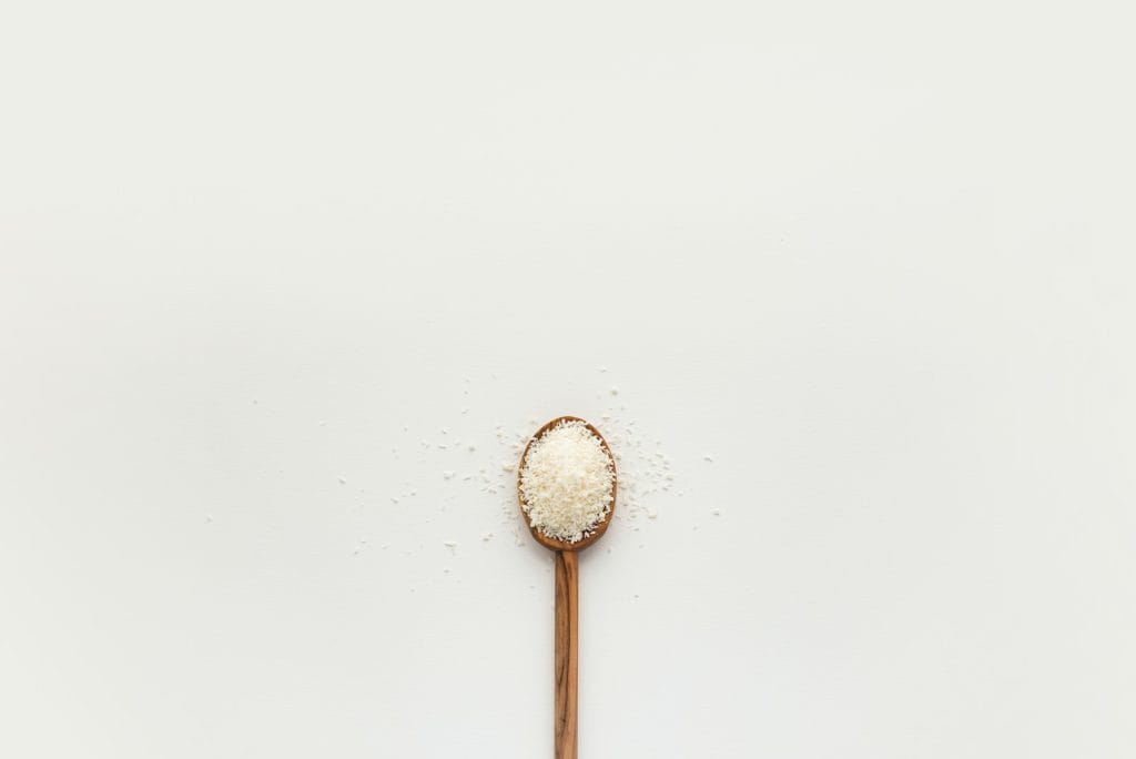 white powder on brown wooden spoon