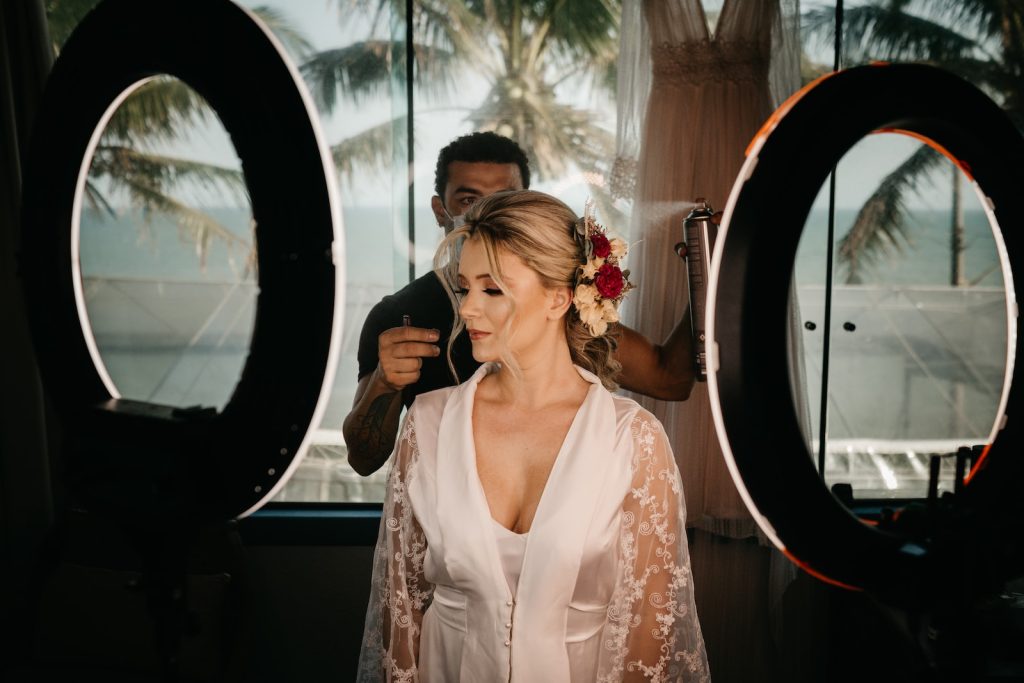 a woman standing in front of a mirror