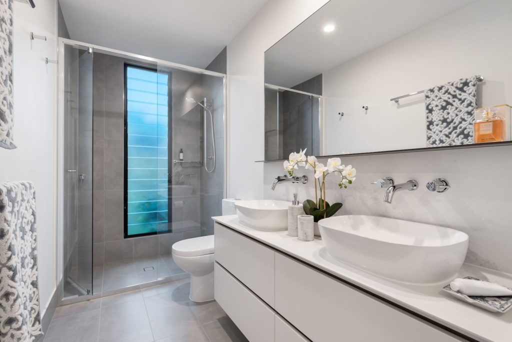 white ceramic sink with mirror