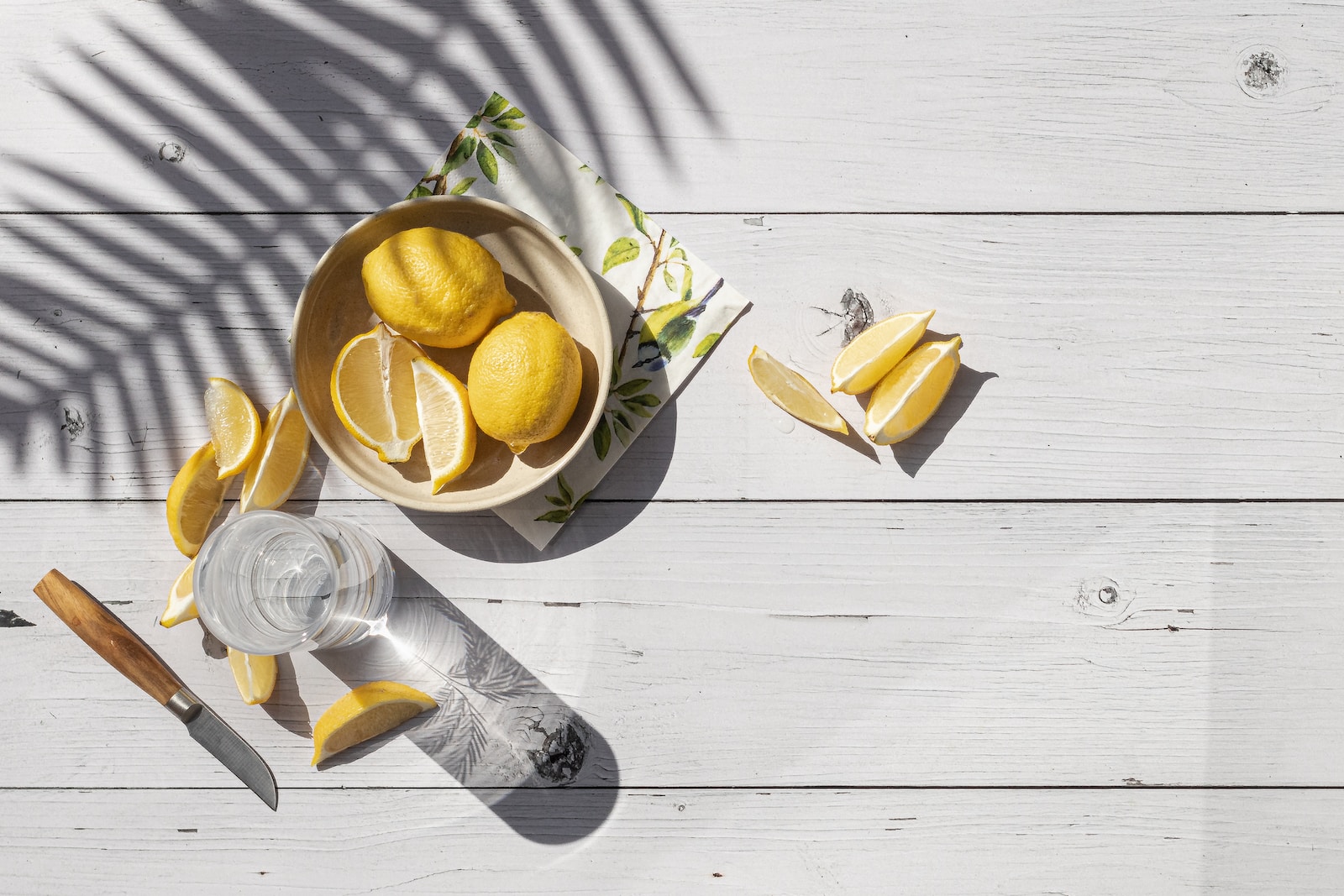 sliced lemon on brown wooden chopping board