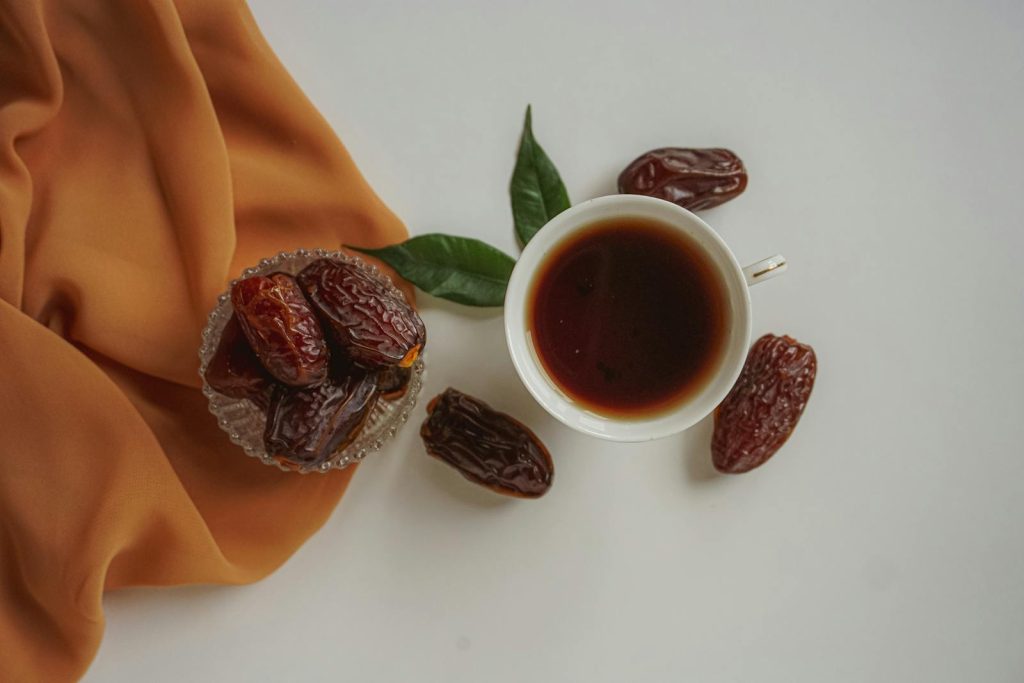 Top View of a Cup of Tea and Dried Dates