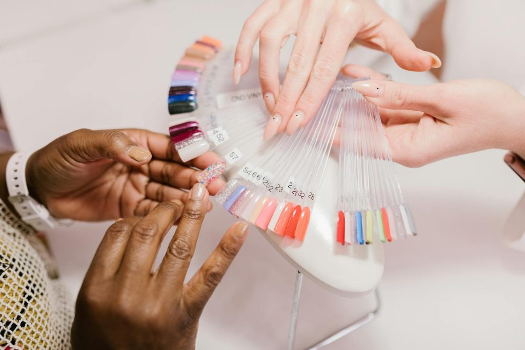 A Client Choosing on a Nail Color Palette