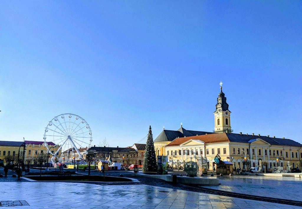 people walking on sidewalk near ferris wheel during daytime